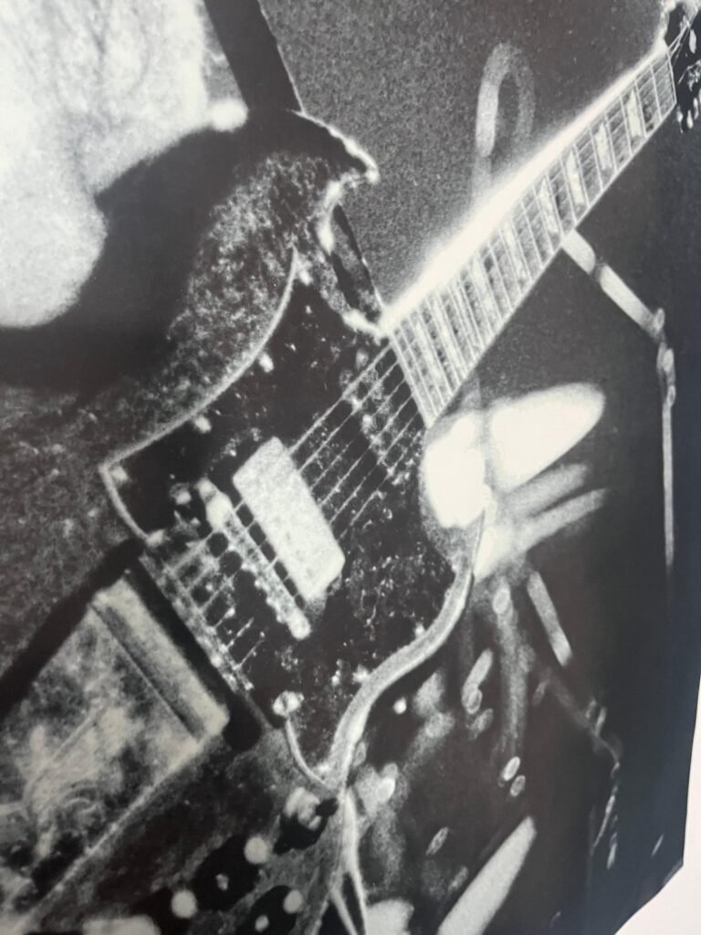 Close-up of a vintage electric guitar with a unique design.
